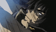 a close up of a cartoon character 's face with a bat on his chest