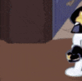 a cartoon character wearing a police hat and sunglasses is standing on a table .