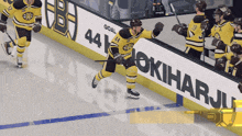 a hockey player with the number 44 on his jersey celebrates his goal