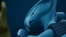 a close up of a blue object with a hole in the middle of it