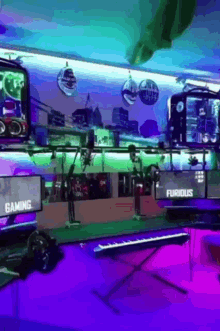 a room with a keyboard and a monitor that says gaming and furious