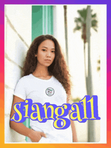 a woman leaning against a wall with the word siangall written on the bottom