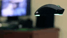 a computer mouse is sitting on a desk in front of a computer monitor