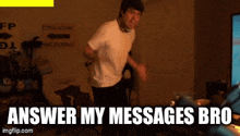 a man is dancing in a room with the words answer my messages bro