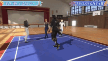a group of people are playing a game on a blue court with a banner that says ' a ' on it