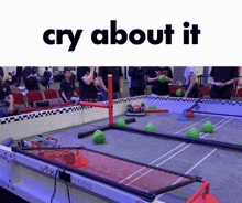 a group of people playing a game with the words cry about it