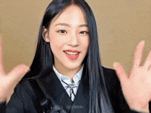 a girl with long black hair is wearing a school uniform with the name njfuerie on the bottom