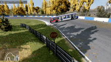a video game shows a bus going around a curve with a stop sign in the foreground