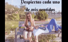 a man and a woman are sitting on a bench with the words " despiertas cada uno de mis sentidos "