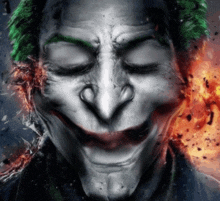 a close up of the face of a joker with his eyes closed