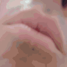 a close up of a person 's lips with hearts coming out of them