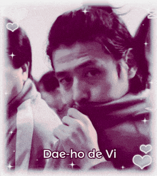 a black and white photo of a man with the name dae-ho de vi