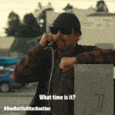 a man wearing sunglasses and a hat is talking on a phone with the words what time is it on the bottom