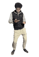 a man in a black vest and white sweatshirt is dancing while holding a cell phone