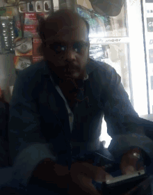 a man sitting in front of a pioneer display