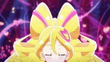 a girl with a yellow bow on her head has a heart on her hair