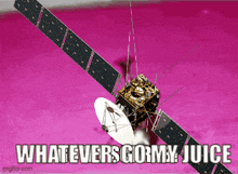 a picture of a satellite with the words whatevers gormy juice above it