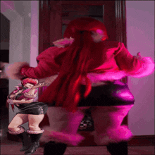 a woman with red hair is standing next to another woman with pink hair