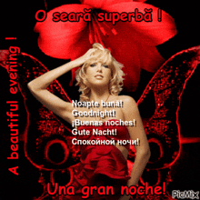 a woman in a red dress is standing in front of a large red flower