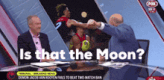 a man in a suit is sitting at a table with two other men and the words is that the moon on the screen