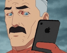 a cartoon man with a mustache is holding a cell phone in his hand .