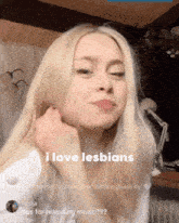 a woman with blonde hair and a caption that says i love lesbians
