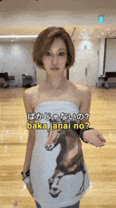 a woman is wearing a shirt with a horse on it and says baka janai no