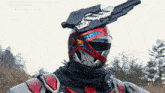 a robot with a helmet and a gun on top of his head