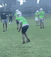 a football player in a neon green jersey with the number 19 on it