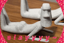 a picture of a statue with the word slayyy written in pink