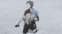 a man is carrying a child in his arms in the snow