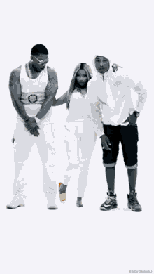 a group of people standing next to each other on a white background . one of the men is wearing a hoodie .