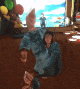 a video game character is dancing in front of a screen
