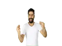 a man with a beard in a white shirt is dancing