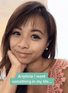 a woman with her hand on her chin and the words anytime i want something in my life on the bottom