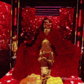 a woman in a red and gold costume with tiffanyluv24 written on the bottom