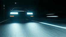 a car is driving down a highway at night