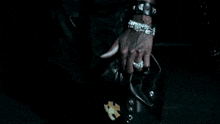 a black and white photo of a necklace with a star shaped pendant