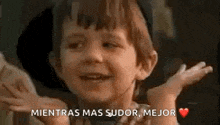 a little boy is making a funny face with his hands in the air and says `` mientras mas sudor mejor '' .