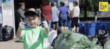 a young boy giving a thumbs up in front of a sign that says 60 seconds docs