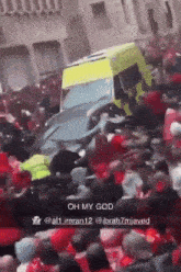 a crowd of people gathered in front of an ambulance that says oh my god on the bottom