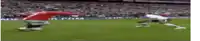 two soccer players are playing a game of soccer on a soccer field .