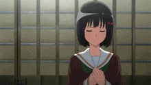 a girl with her eyes closed is wearing a helmet on her head