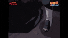 a close up of a cartoon character 's face with a naruto logo in the background .