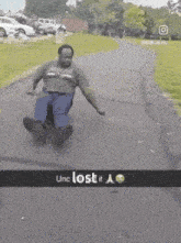 a man is sliding down a road with the words unc lost it a
