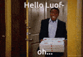 a man in a suit is carrying three boxes of pizza and says hello luof oh