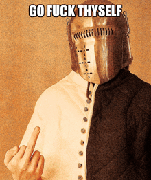 a man in a knight 's helmet giving the middle finger with the words go fuck thyself above him