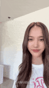 a woman with long brown hair is wearing a white shirt that says mooduseries