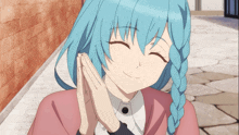 a girl with blue hair has her hands folded on her face