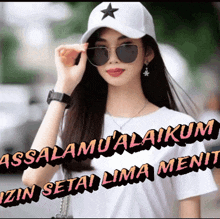 a woman wearing sunglasses and a hat with the words assalamualaikum izn setai lima ment below her